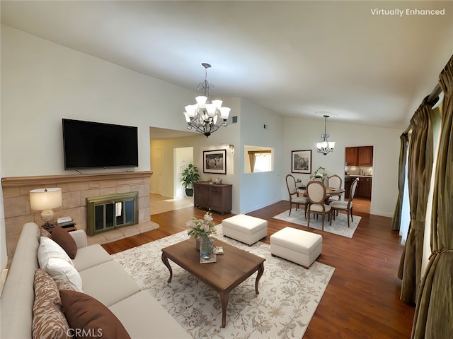 25488 Orange Crest Way, Loma Linda, CA 92354 - living area featuring a chandelier, lofted ceiling, wood finished floors, and a tiled fireplace