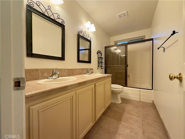 25488 Orange Crest Way, Loma Linda, CA 92354 - bathroom with double vanity, enclosed tub / shower combo, and tile patterned flooring