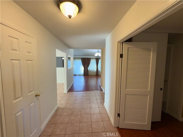 25488 Orange Crest Way, Loma Linda, CA 92354 - hall featuring a chandelier and light tile patterned flooring