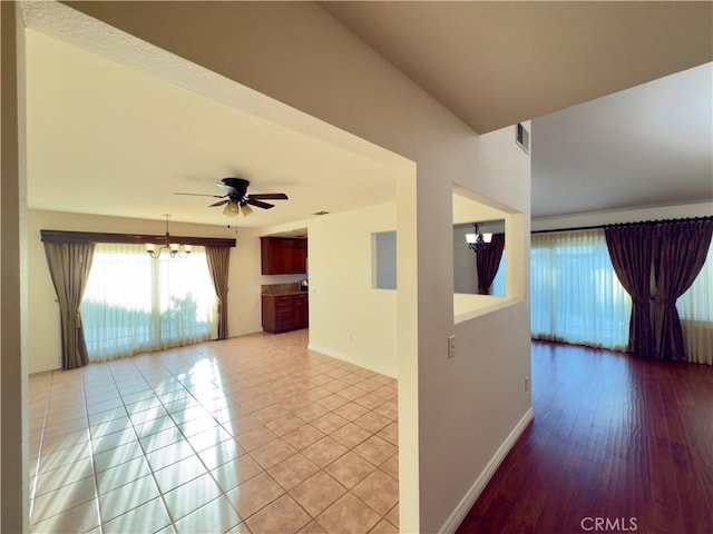 25488 Orange Crest Way, Loma Linda, CA 92354 - spare room with a chandelier, ceiling fan, and light tile patterned floors