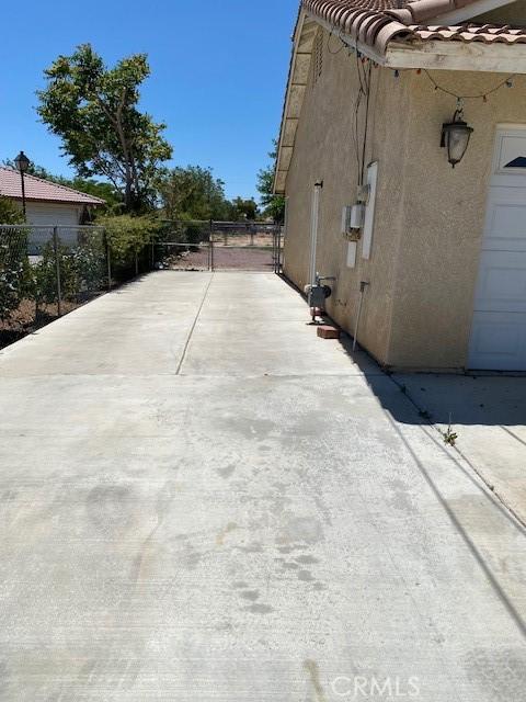 15805 Muscatel St, Hesperia, CA 92345 - view of property exterior with stucco siding and a tile roof