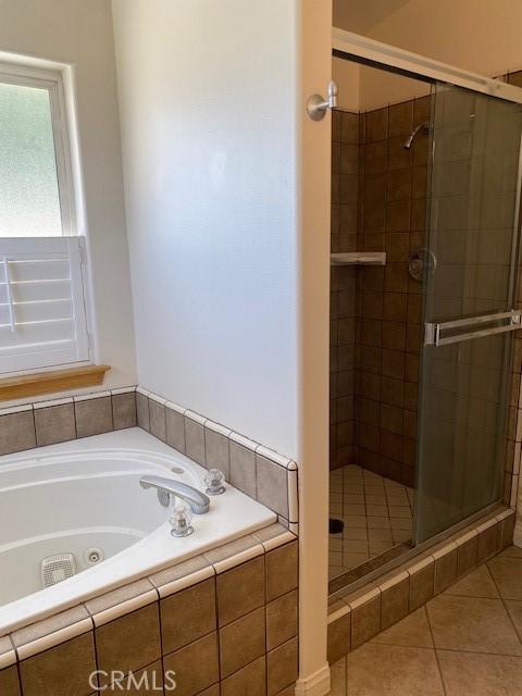 15805 Muscatel St, Hesperia, CA 92345 - bathroom with a shower stall, a tub with jets, and tile patterned flooring