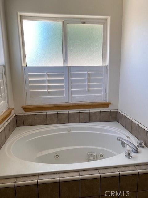 15805 Muscatel St, Hesperia, CA 92345 - bathroom with a jetted tub and plenty of natural light