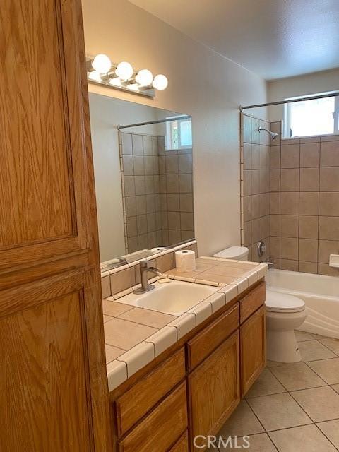 15805 Muscatel St, Hesperia, CA 92345 - full bathroom with vanity, tile patterned floors, and shower / washtub combination