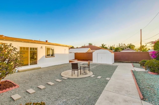482 Wykes St, Chula Vista, CA 91911 - fenced backyard with a storage unit, a patio, and outdoor dining space