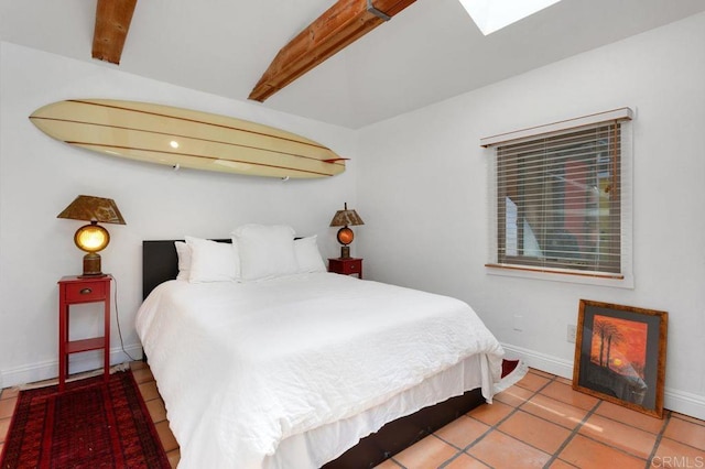 934 Arden Dr, Encinitas, CA 92024 - bedroom featuring beam ceiling, tile patterned flooring, and a skylight