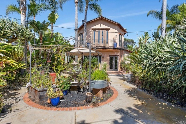 934 Arden Dr, Encinitas, CA 92024 - back of house with a balcony, french doors, and stucco siding