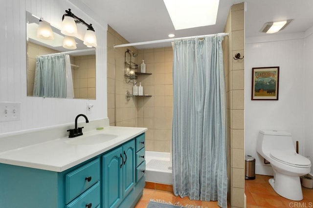 934 Arden Dr, Encinitas, CA 92024 - full bathroom with vanity, a tile shower, tile patterned floors, a skylight, and recessed lighting