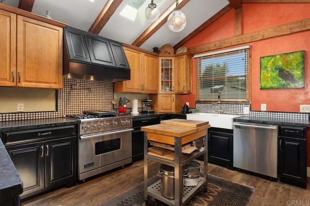 934 Arden Dr, Encinitas, CA 92024 - kitchen with appliances with stainless steel finishes, dark countertops, and dark wood-style flooring