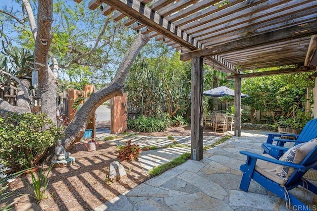 934 Arden Dr, Encinitas, CA 92024 - fenced backyard with a pergola, outdoor dining space, and a patio area