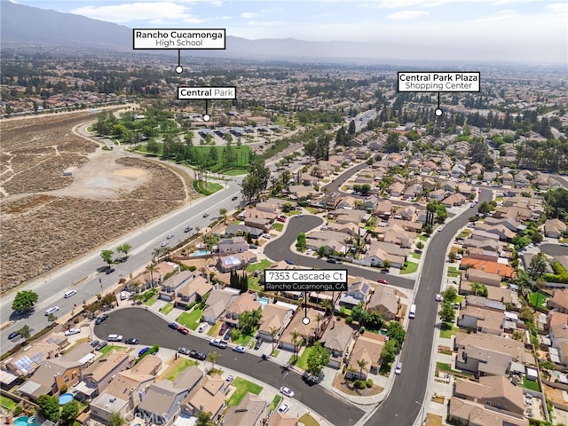 7353 Cascade Ct, Rancho Cucamonga, CA 91730 - aerial overview of property's location featuring a mountain backdrop and nearby suburban area