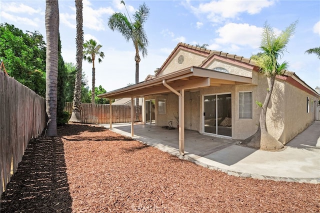 7353 Cascade Ct, Rancho Cucamonga, CA 91730 - back of property featuring stucco siding, a fenced backyard, and a patio