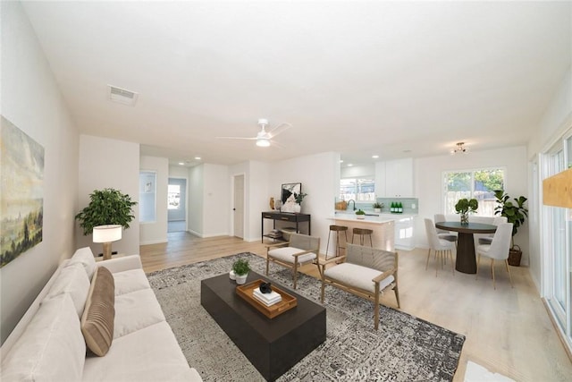 5955 Scheelite St, Jurupa Valley, CA 92509 - living area featuring light wood-type flooring and ceiling fan