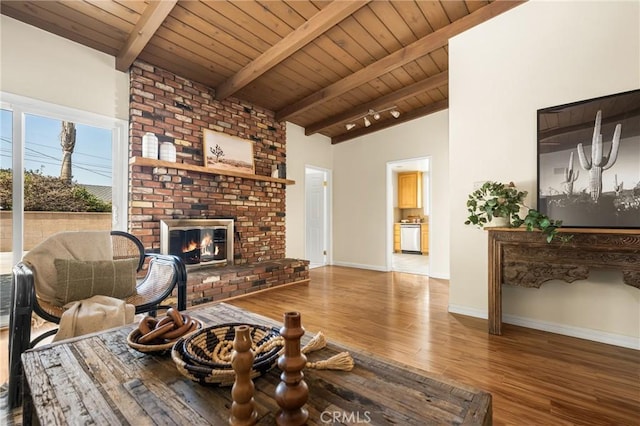 15027 Barnwall St, La Mirada, CA 90638 - living room featuring wood ceiling, wood finished floors, and a brick fireplace