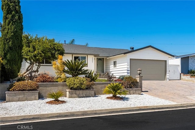 15027 Barnwall St, La Mirada, CA 90638 - ranch-style home with a garage and driveway