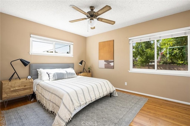 15027 Barnwall St, La Mirada, CA 90638 - bedroom with wood finished floors, a textured ceiling, and a ceiling fan