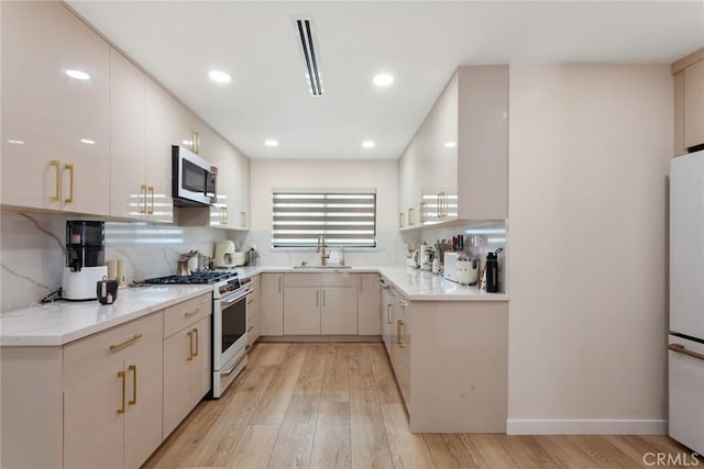 10535 Reseda Blvd, Porter Ranch, CA 91326 - kitchen featuring white appliances, light wood-type flooring, tasteful backsplash, and recessed lighting