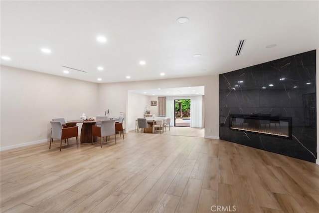 10535 Reseda Blvd, Porter Ranch, CA 91326 - living room featuring light wood-type flooring, recessed lighting, and a premium fireplace