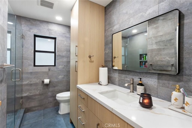 10535 Reseda Blvd, Porter Ranch, CA 91326 - bathroom featuring tile walls, vanity, a shower stall, and tile patterned floors