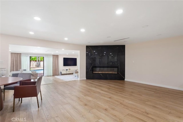 10535 Reseda Blvd, Porter Ranch, CA 91326 - living room featuring light wood-type flooring, a large fireplace, and recessed lighting
