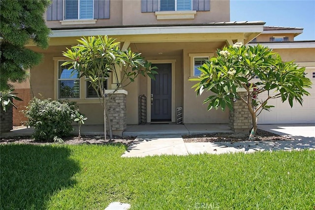 5621 Avocet Dr, Jurupa Valley, CA 91752 - property entrance featuring stucco siding and a lawn