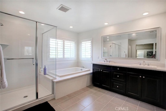5621 Avocet Dr, Jurupa Valley, CA 91752 - full bathroom featuring a stall shower, a garden tub, double vanity, tile patterned flooring, and recessed lighting