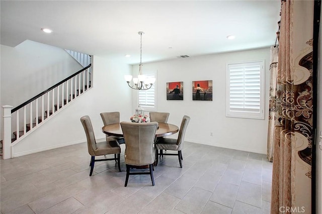 5621 Avocet Dr, Jurupa Valley, CA 91752 - dining area with stairs, a chandelier, and recessed lighting