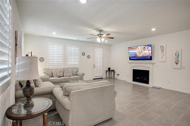 5621 Avocet Dr, Jurupa Valley, CA 91752 - living room with a ceiling fan, a fireplace with raised hearth, recessed lighting, and tile patterned flooring