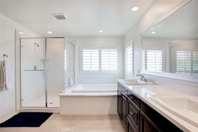 5621 Avocet Dr, Jurupa Valley, CA 91752 - full bathroom with a shower stall, a bath, double vanity, tile patterned flooring, and recessed lighting