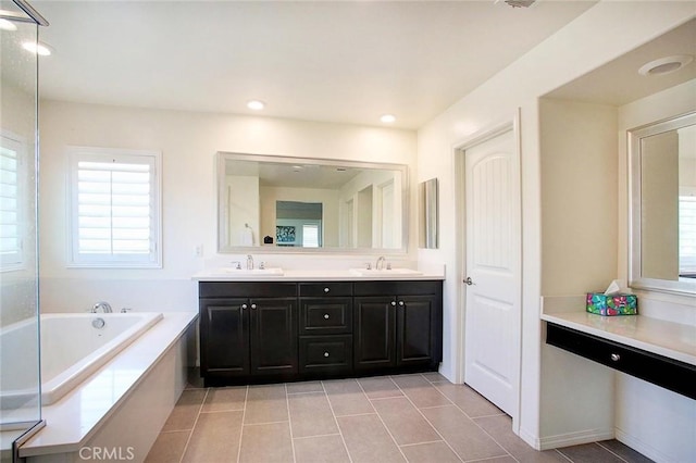 5621 Avocet Dr, Jurupa Valley, CA 91752 - full bathroom featuring plenty of natural light, double vanity, a bath, tile patterned flooring, and recessed lighting