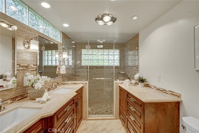 4843 Texhoma Ave, Encino, CA 91316 - bathroom featuring plenty of natural light, double vanity, a shower stall, tasteful backsplash, and recessed lighting