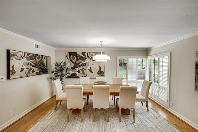 4843 Texhoma Ave, Encino, CA 91316 - dining room featuring light wood-type flooring and ornamental molding