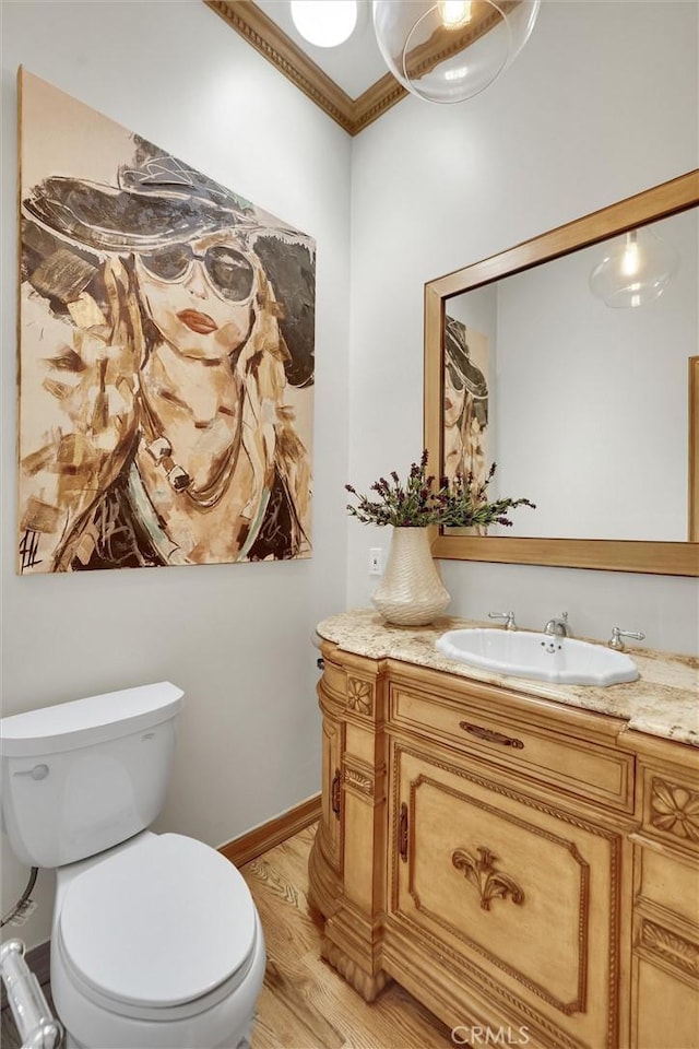 4843 Texhoma Ave, Encino, CA 91316 - half bathroom with vanity, wood finished floors, and ornamental molding