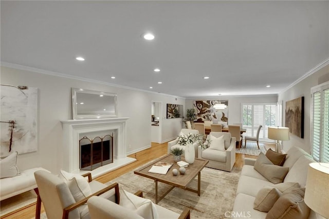4843 Texhoma Ave, Encino, CA 91316 - living area with ornamental molding, recessed lighting, light wood-style flooring, and a fireplace with raised hearth