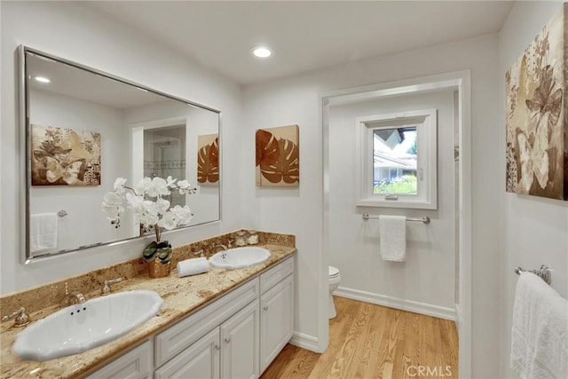 4843 Texhoma Ave, Encino, CA 91316 - full bath with wood finished floors, double vanity, and recessed lighting