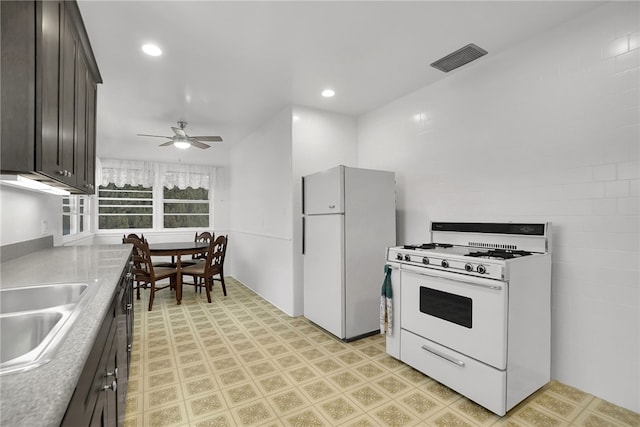 824 De La Fuente St, Monterey Park, CA 91754 - kitchen featuring white appliances, light flooring, dark brown cabinetry, ceiling fan, and recessed lighting