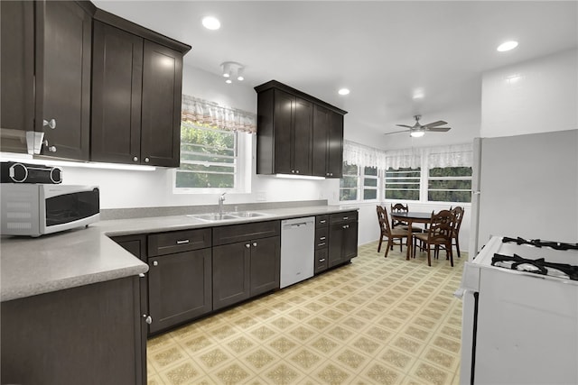 824 De La Fuente St, Monterey Park, CA 91754 - kitchen with white appliances, light flooring, a ceiling fan, dark brown cabinets, and light countertops