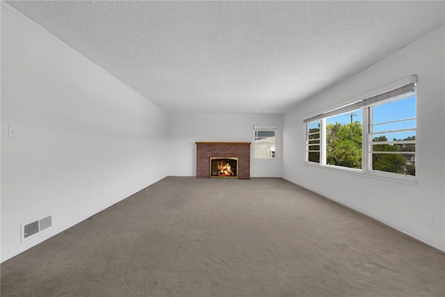 824 De La Fuente St, Monterey Park, CA 91754 - unfurnished living room featuring a textured ceiling, carpet floors, and a brick fireplace