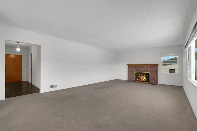 824 De La Fuente St, Monterey Park, CA 91754 - unfurnished living room featuring carpet flooring, a textured ceiling, and a fireplace