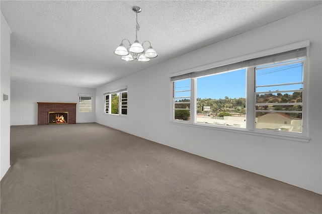 824 De La Fuente St, Monterey Park, CA 91754 - unfurnished living room with a chandelier, carpet floors, a textured ceiling, and a lit fireplace
