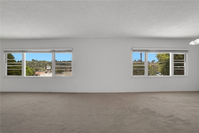 824 De La Fuente St, Monterey Park, CA 91754 - carpeted empty room with a textured ceiling and healthy amount of natural light