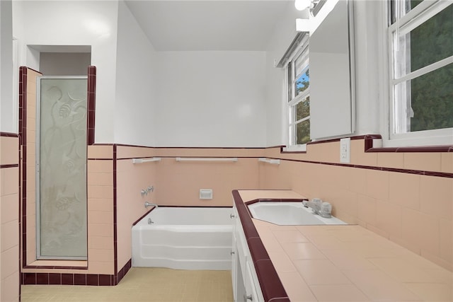 824 De La Fuente St, Monterey Park, CA 91754 - full bath with vanity, tile walls, a garden tub, a shower stall, and tile patterned flooring