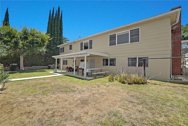 824 De La Fuente St, Monterey Park, CA 91754 - back of house featuring a patio area and a lawn
