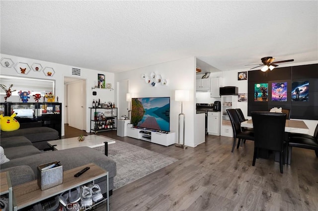 10757 Hortense St Unit 102, North Hollywood, CA 91602 - living room featuring ceiling fan, dark wood finished floors, and a textured ceiling