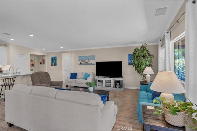 29183 Jacaranda, Lake Elsinore, CA 92530 - living area with light wood-style flooring, ornamental molding, and recessed lighting