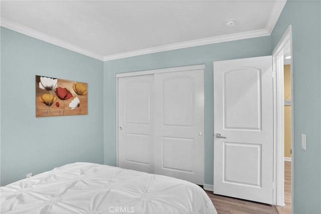 29183 Jacaranda, Lake Elsinore, CA 92530 - bedroom featuring wood finished floors, ornamental molding, and a closet