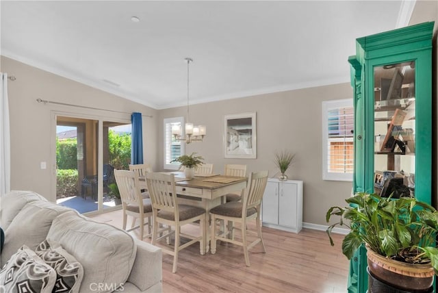 29183 Jacaranda, Lake Elsinore, CA 92530 - dining area featuring a chandelier, light wood-style floors, ornamental molding, and lofted ceiling