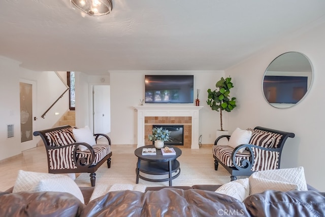 1906 S Patton Ave, San Pedro, CA 90732 - living room featuring stairs, a tiled fireplace, and ornamental molding