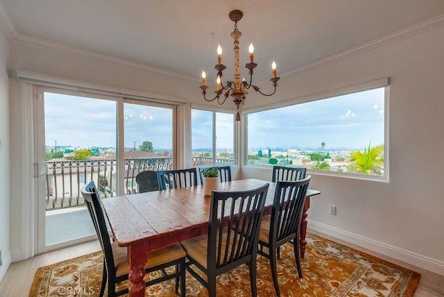 1906 S Patton Ave, San Pedro, CA 90732 - dining room with a chandelier, crown molding, healthy amount of natural light, and light wood-style floors