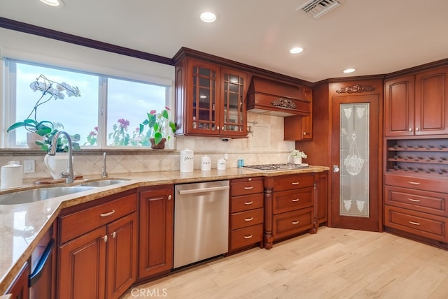 1906 S Patton Ave, San Pedro, CA 90732 - kitchen with stainless steel appliances, light wood finished floors, light stone counters, decorative backsplash, and crown molding